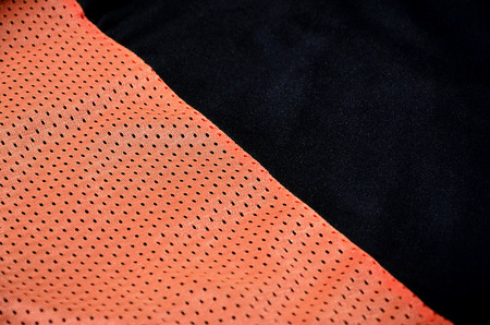 Close up of red polyester nylon sportswear shorts to created a textured backgroundの写真素材