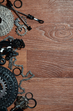 Many different metal parts and components of the running gear of a sports bike. Brake levers, sprockets, gears, pinions and many other components for bicycle assembly. Bicycle repair conceptの写真素材