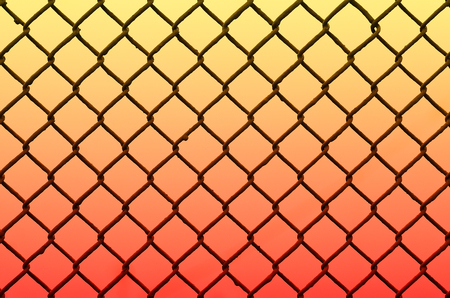 Texture of an old and rusty metal grid on a neutral colored background. The concept of heavy industry, imprisonment or poorly designed fencingの写真素材