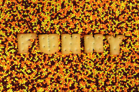 Funny. The word from the edible cracker letters lies on the glazed powder. A huge number of sweet, colorful 
beads of very small size for decoration of pastry products の写真素材