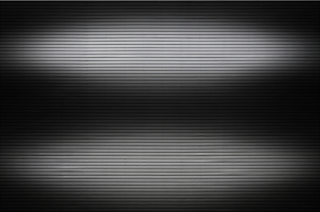 The texture of a metal wall or a surface of corrugated metal with invisible light sources that illuminate the middle of the platform for product placementの写真素材