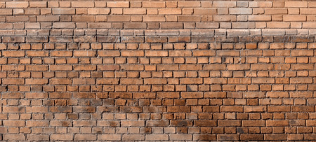 The texture of red wall from a variety of old and dirty brick. Detailed pattern of a plurality of different sizes of brick worn outの写真素材
