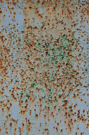 Rusty metal texture with scratched surface. Old painted metal wall with peeling paint. Texture obsolete painting metal fence close-upの写真素材