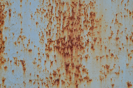 Rusty metal texture with scratched surface. Old painted metal wall with peeling paint. Texture obsolete painting metal fence close-upの写真素材