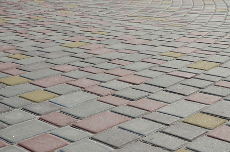 Cobbles texture - hard pavement, a kind of pavement, laid out by flat rectangular (or other shape) bars of approximately the same shape and sizeの写真素材