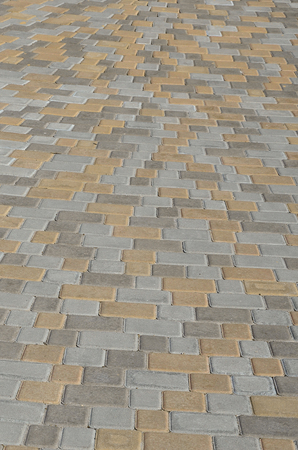 Cobbles texture - hard pavement, a kind of pavement, laid out by flat rectangular (or other shape) bars of approximately the same shape and sizeの写真素材