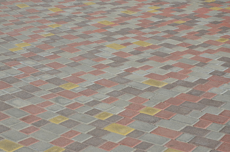Cobbles texture - hard pavement, a kind of pavement, laid out by flat rectangular (or other shape) bars of approximately the same shape and sizeの写真素材