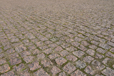 A large area, laid out of paving stone in perspective. Detailed photo of paving stones in the sidewalk avenue close-upの写真素材