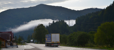 Asphalt road in the mountainous terrain in the morningの写真素材