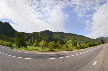 Asphalt road in the mountainous terrain in the morningの写真素材