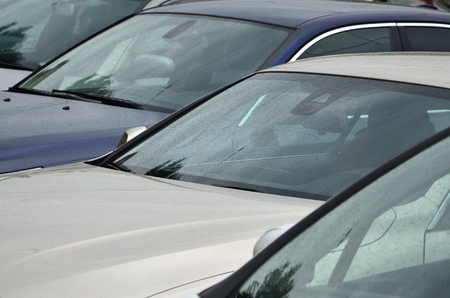 Roofs of several cars. A lot of cars stand close at rush hourの写真素材