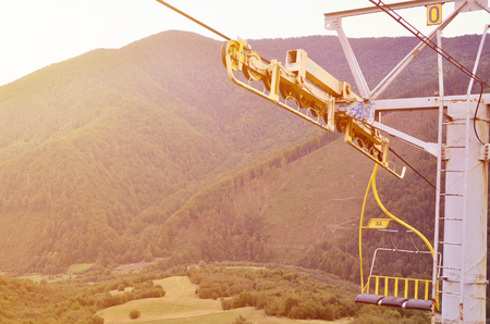 The seats of the cable car on the background of Mount Makovitsa, one of the Carpathian Mountainsの写真素材