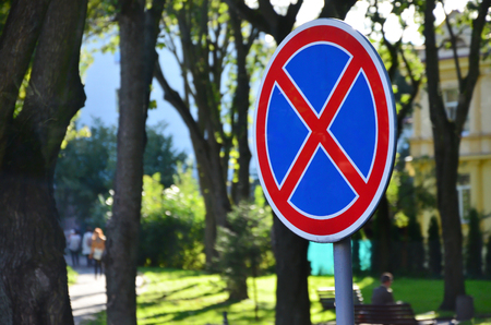 Round road sign with a red cross on a blue background. A sign means a parking prohibitionの写真素材