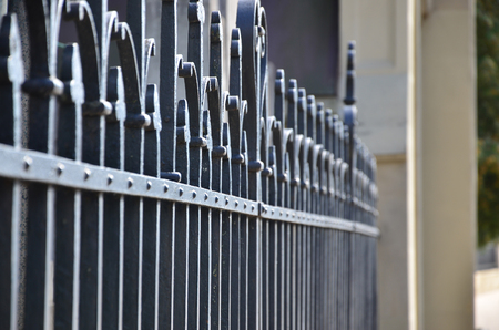 Photo of a decorative metal fence from the cemetery. Selective focus and shallow depth of fieldの写真素材