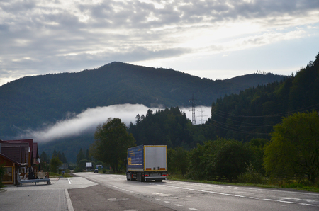 Asphalt road in the mountainous terrain in the morningの写真素材