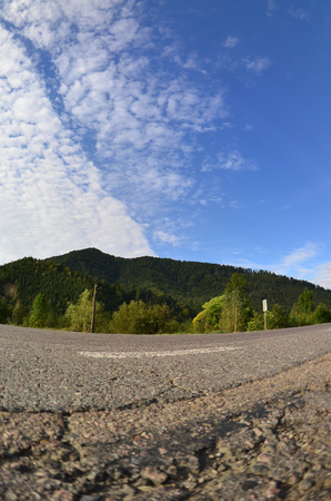 Asphalt road in the mountainous terrain in the morningの写真素材