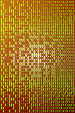 An image of a binary code made up of a set of green digits on a black background. Tonedの写真素材