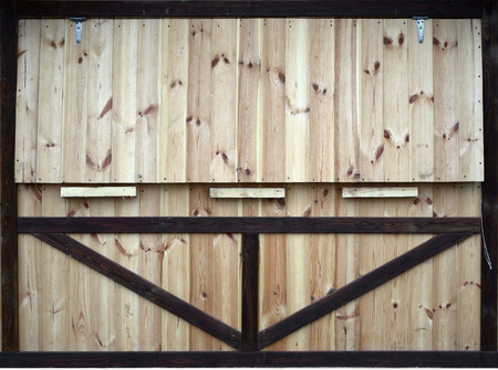 Wooden background. Texture of a wooden wall with dark and light planks. Unpainted boardの写真素材