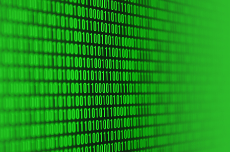 An image of a binary code made up of a set of green digits on a black backgroundの写真素材