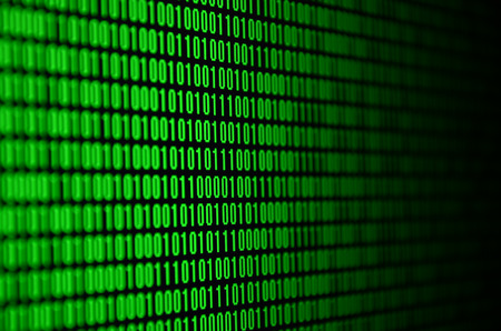 An image of a binary code made up of a set of green digits on a black backgroundの写真素材