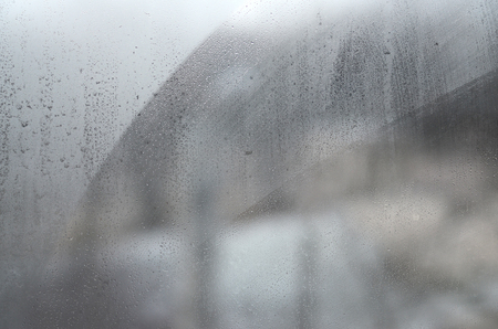 Window glass with condensate or steam after heavy rain, Texture or background imageの写真素材