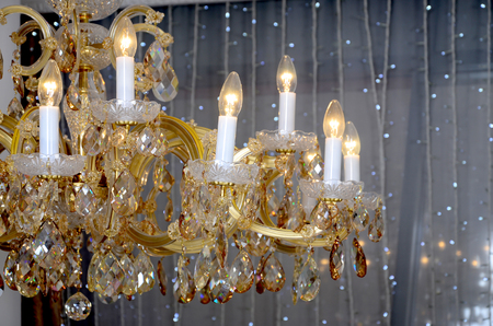 An ancient hanging retro chandelier with built-in lamps for electric lightingの写真素材