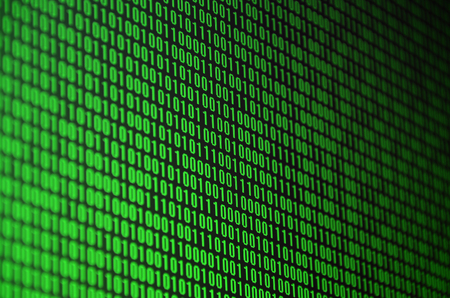 An image of a binary code made up of a set of green digits on a black backgroundの写真素材