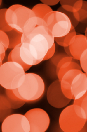 Abstract blurred of red glittering shine bulbs lights background. Blur of Christmas wallpaper decorations conceptの写真素材