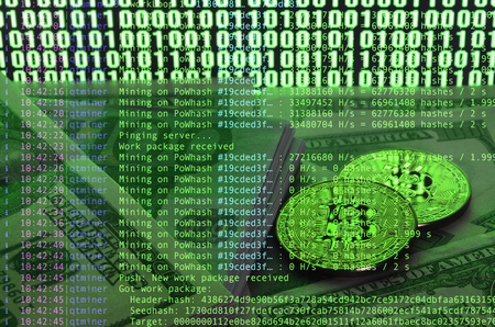 Image of the program code showing the process of mining the crypto currency in the background of the image with bitcoinの写真素材