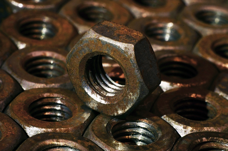 Closeup of a pile of rusty nuts. Retro industrial conceptの写真素材