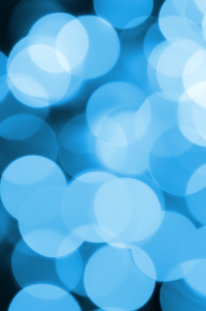 Blue Festive Christmas elegant abstract background with many bokeh lights. Defocused artistic imageの写真素材