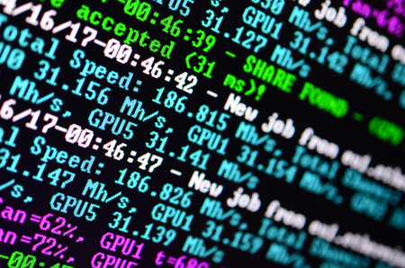 Macro snapshot of the program interface for crypto currency mining on the monitor of an office...