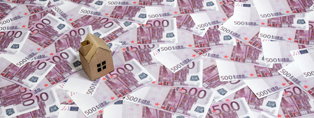 High Angle View Of A cardboard toy house On 500 Euro Notes. Money of euro for purchase of the private house. Mortgage conceptの写真素材