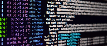Macro snapshot of the program interface for crypto currency mining on the monitor of an office computer. The concept of mining bitcoins. The flow of information strings and dataの写真素材