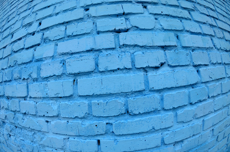 Large brick wall, painted in blue. Fisheye photo with pronounced distortionの写真素材