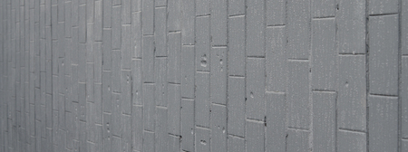The texture of the wall from the old tile, painted gray under the influence of condensation. A lot of small drops and water stains on the wallの写真素材