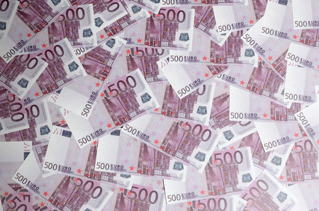 Money background consisting of purple five hundred Euro bills spread across the screen. Symbolic texture photo of wealthの写真素材
