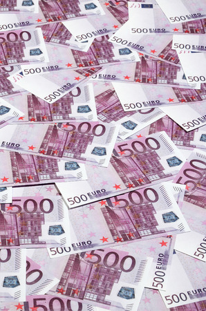 Money background consisting of purple five hundred Euro bills spread across the screen. Symbolic texture photo of wealthの写真素材