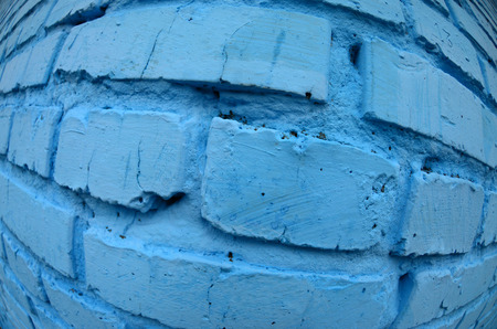 Large brick wall, painted in blue. Fisheye photo with pronounced distortionの写真素材