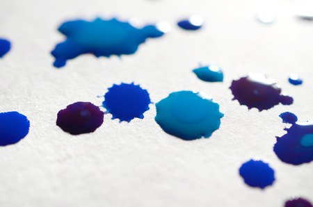 Abstract background illustration in the form of watercolor drops of blue color. Macro picture of a wet watercolor pictureの写真素材