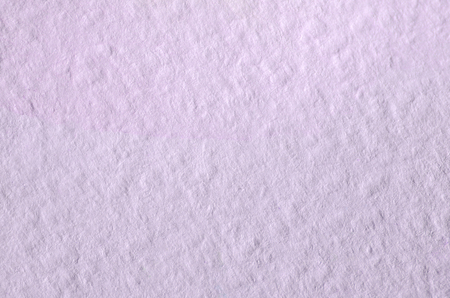 Texture of thick paper intended for watercolor painting. Macro snapshot of details of the relief paper structureの写真素材