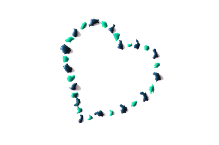 Image of a heart made from wet drops of watercolor paint, isolated on whiteの写真素材