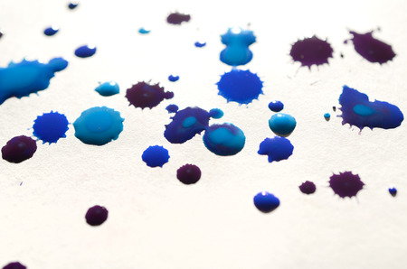 Abstract background illustration in the form of watercolor drops of blue color. Macro picture of a wet watercolor pictureの写真素材