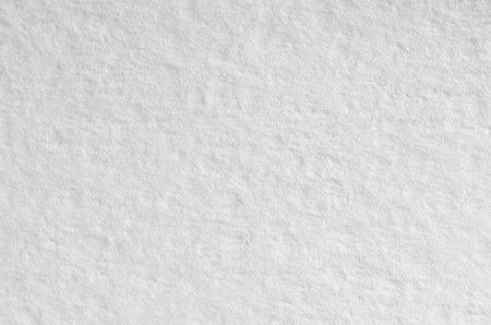 Texture of thick paper intended for watercolor painting. Macro snapshot of details of the relief paper structureの写真素材