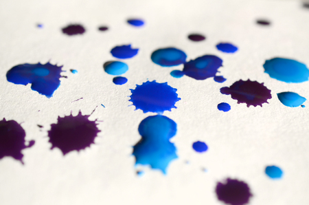 Abstract background illustration in the form of watercolor drops of blue color. Macro picture of a wet watercolor pictureの写真素材