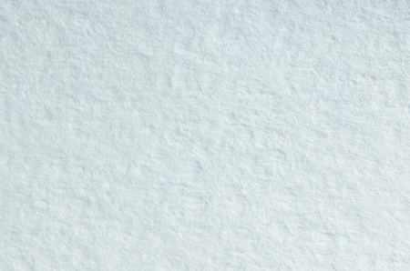Texture of thick paper intended for watercolor painting. Macro snapshot of details of the relief paper structureの写真素材
