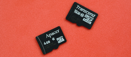 KHARKOV, UKRAINE - DECEMBER 29, 2017: Two small micro SD memory cards Apacer 4gb and Transcend 16gb...