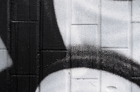 A fragment of a graffiti pattern, applied to a wall of cold tiles, which is covered with a fine condensate. The concept of street art in inappropriate weatherの写真素材