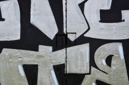 Texture of a fragment of the wall with graffiti painting, which is depicted on it. An image of a...