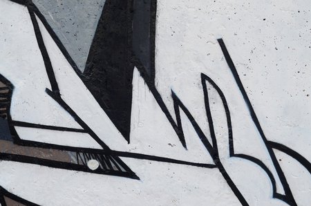 Background image of a concrete wall with a piece of abstract graffiti pattern. Street art, vandalism and youth hobbiesの写真素材